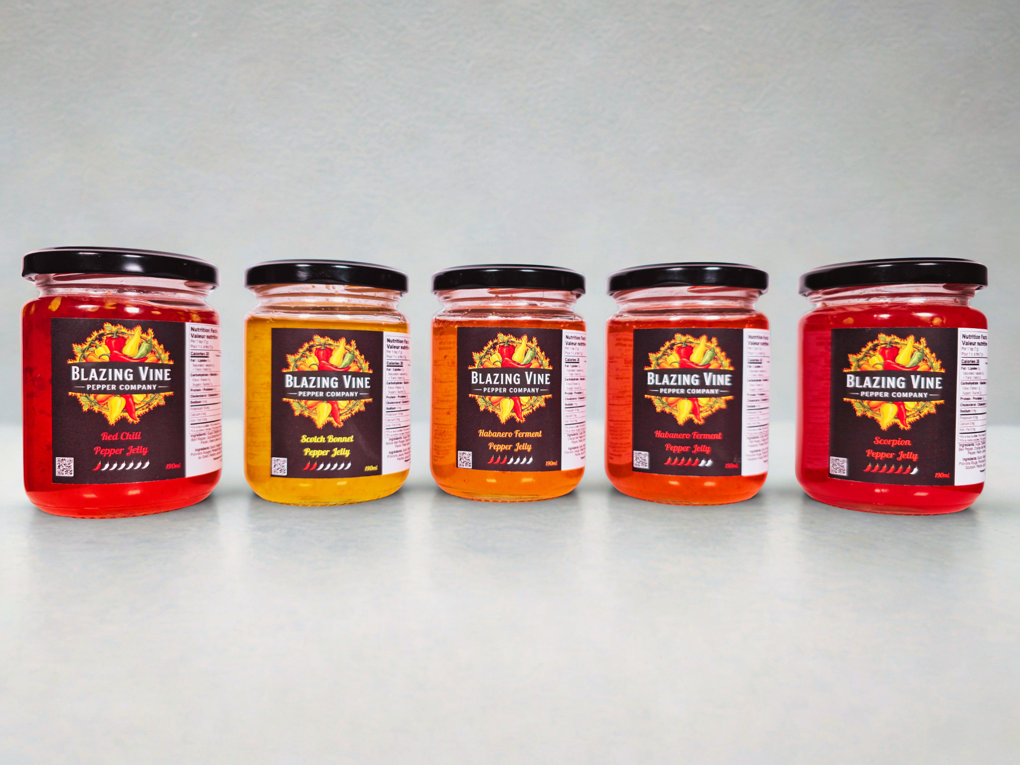 Five Blazing Vine Pepper Jelly jars — the full collection